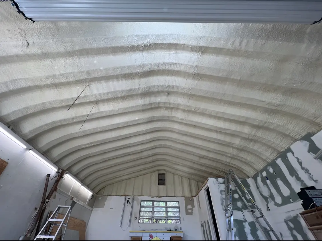 Spray polyurethane foam applied to the underside of a metal roof deck in Kemp Mill